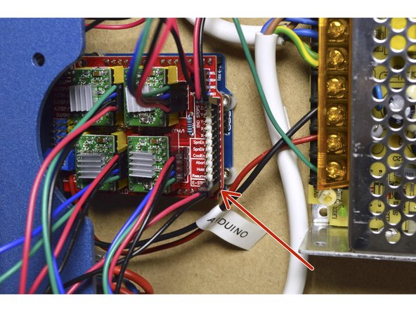 Connect the 2-pin connector of the Emergency-Stop to the E-STOP port on the bottom right pins on the controller board as shown