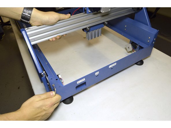 Move the Y-Axis to the back and tighten the M5x20 Button head screws on the back plate with the 3mm Allen Key