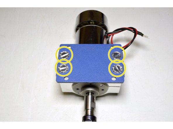 Place the Spindle plate on the back of the spindle bracket as shown in the picture