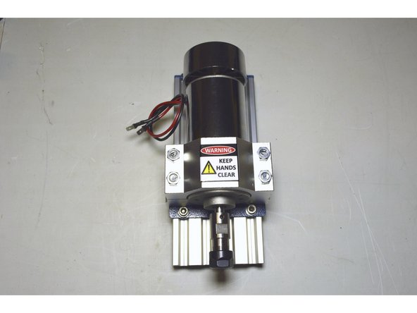Fasten the Spindle Plate to the V-Slot profile with the M5x10 cap screws (4 Pcs), M5 Washers (4 Pcs) and Pratley Pratlock by using the 4mm Allen Key