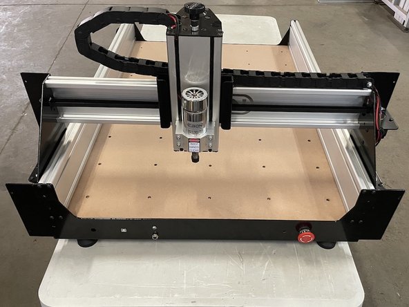 Slide the X-Gantry to the front against the front plate and tighten the 8 x M5x16 button head cap screws holding the front plate.