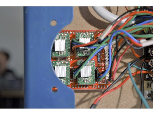 Remove the two screws mounting the fan above the electronics