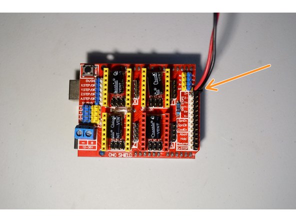 Connect the 2-pin connector from the mosfet board to the controller board as shown.  It connects to the Z+ pins and the black cable connects to the black pin and the red cable to the white pin