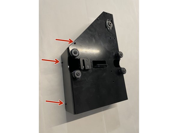 Remove the cover from the left gantry by unscrewing the 6 screws as shown in the pictures with the philips screw driver