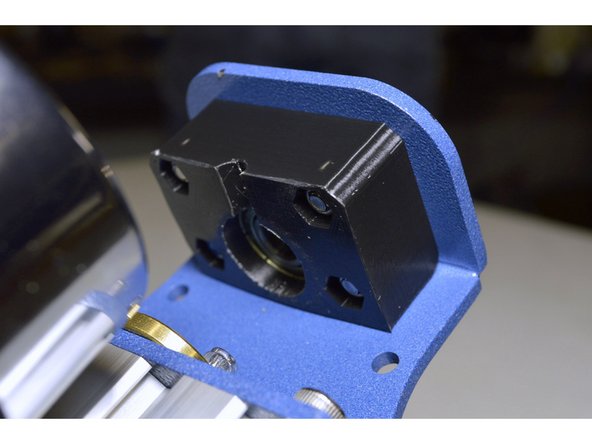 Mount the beating block onto the Spindle Z-Axis Assembly with the M4x20 cap screws (4 Pcs), M4 Washers (4 Pcs) and M4 Lock Nuts (4 Pcs)