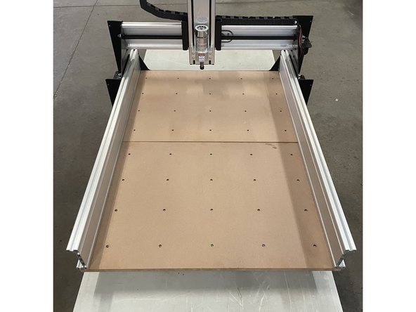Slide the waste board(s) onto the aluminium profiles as shown in the pictures.  Do not tighten these screws at this stage.