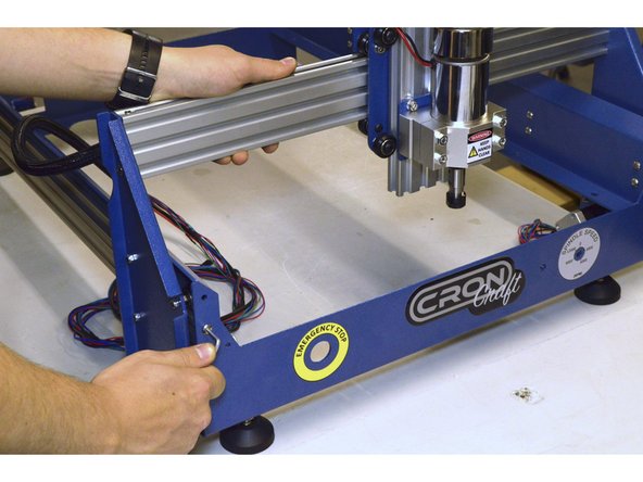 Move the Y-Axis to the front and tighten the M5x20 Button head screws on the front plate with the 3mm Allen Key