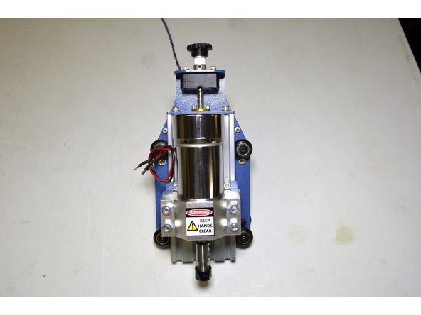 Push the Z-knob and bottom collet towards each other, while tightening the bottom collet