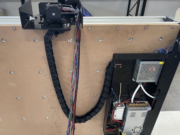 Mount the other side of the drag chain to the Electronics Assembly with 3 x M4x12 Counter Sunk Screws and 3 x M4 Lock Nuts.