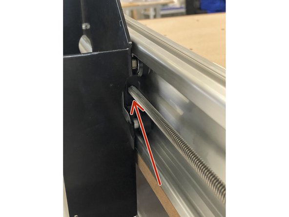 Insert Y lead screws into the lead screw blocks on the inside of the left and right gantries.