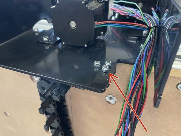 Mount the drag chain to the Right Gantry with 3 x M4x12 Counter Sunk Screws and 3 x M4 Lock Nuts. Use the 2.5mm Allen Key and No.7 Spanner to do this.