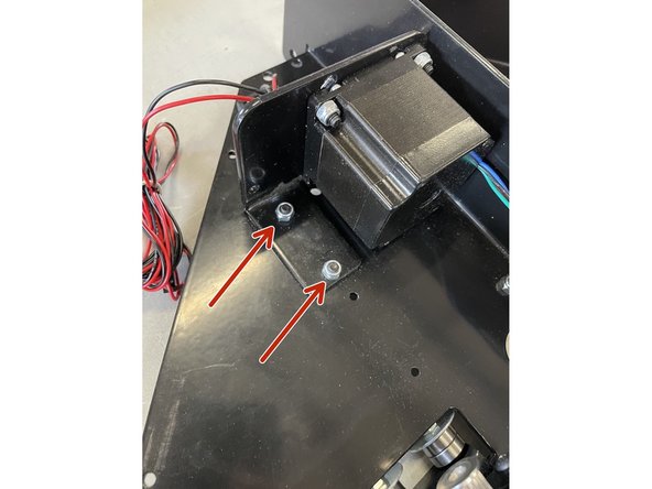 Remove the 2 screws holding the top motor inside the right gantry with the 3mm Allen Key and No 8 Spanner.