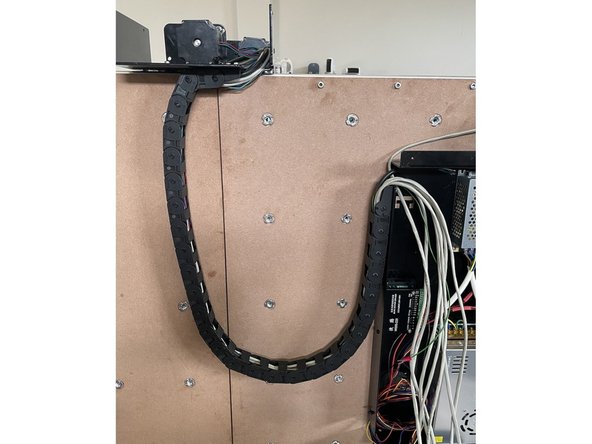 Close the links of the drag chain by pressing them closed one by one.  Make sure all the wires from the Right Gantry runs inside the drag chain.