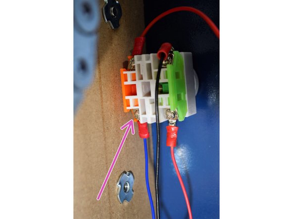 Connect the 12V E-Stop cable to the orange side (normally Closed) on the E-Stop as shown