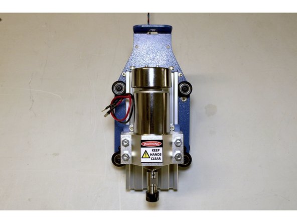 Once the Spindle Assembly is in place, tighten the two V-Wheels on the right with the 3mm Allen Key and the No. 8 spanner