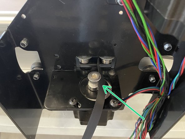 Take the 10mm GT2 belt mounted to the back plate and route it around the bearings and pulley in the left and right gantries and to the front plate.