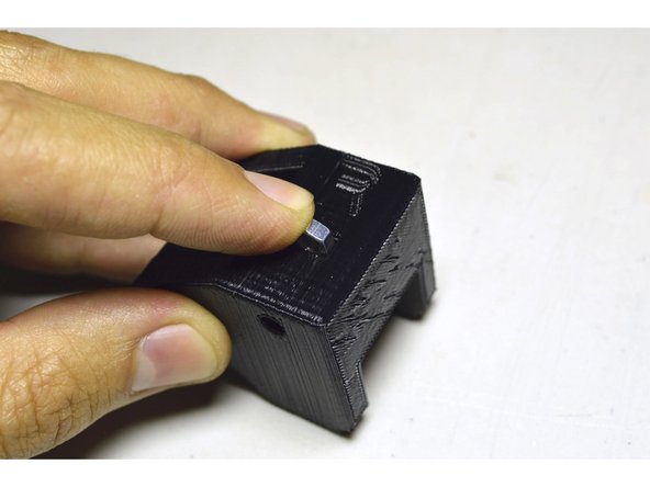 Slide the M4 Nuts (2 Pcs) into the slots provided in the Printed Parts