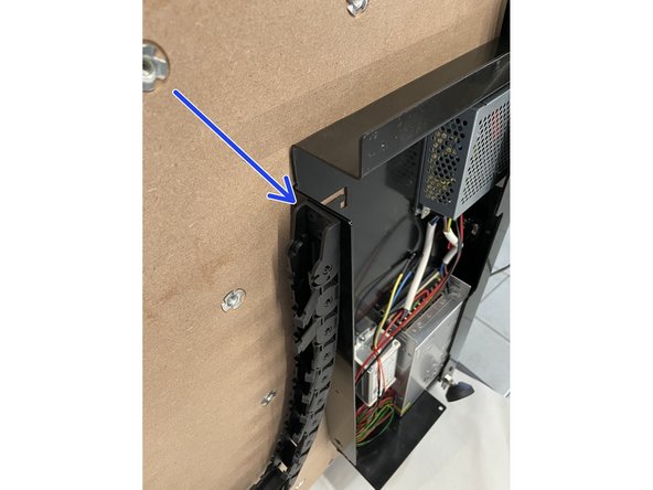 The drag chain can only be fastened in one orientation due to the spacing of the holes.  So if the 3 holes in the drag chain does not line up with the holes in the steel plate, flip the drag chain around.