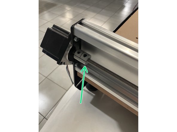 Screw the lead screws in so that they reach the rigid coupling mounted to the Y motors.