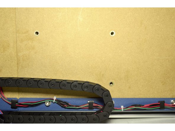 Use the Cable Clips with adhesive to mount the cables to the blue frame