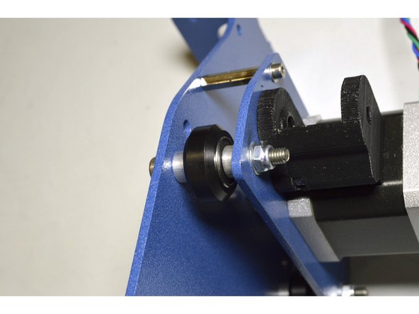 The order of components on the M5x40 screw are: M5 Washer, Z-Axis plate, Aluminium spacer, V-wheel Assembly, Aluminium spacer, X-Motor Plate, M5 Washer, M5 Lock nut