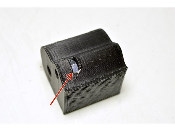 Insert the M4 nut into the slot in the printed Drag Chain Motor Bracket