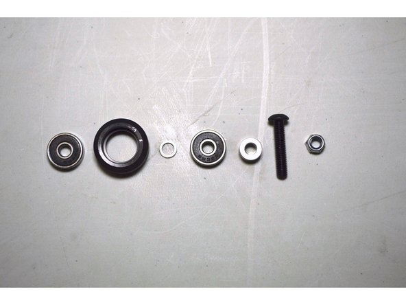 Press the bearing into the delrin V-wheel