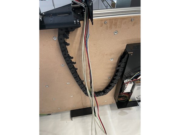 Mount the other side of the drag chain to the Electronics Assembly with 3 x M4x12 Counter Sunk Screws and 3 x M4 Lock Nuts.