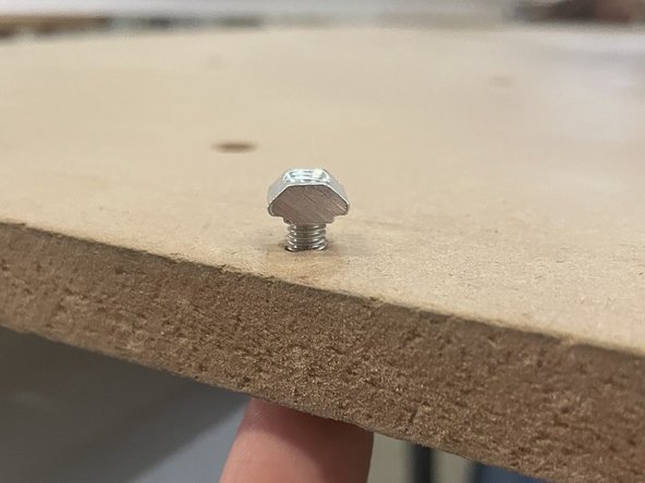 Add 10 x M5x20 cap screws and 10 x M5 T-Nuts to each waste board as shown in the pictures.