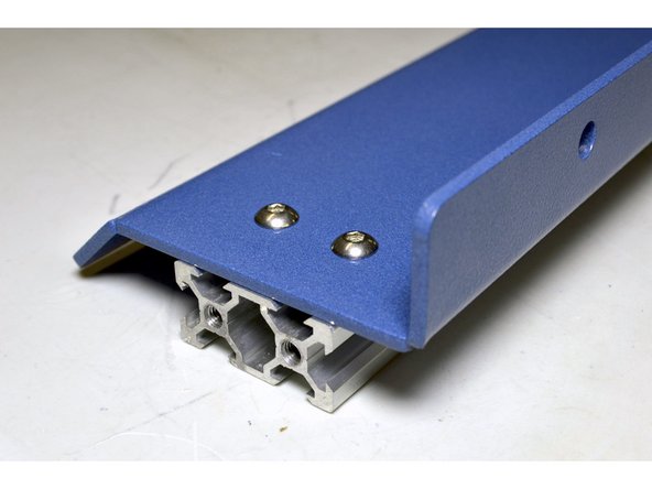 Use the M5x8 button head screws (6 Pcs per side cover) and mount it to the V-Slot Profile while adding Pratley Pratlock to the screws