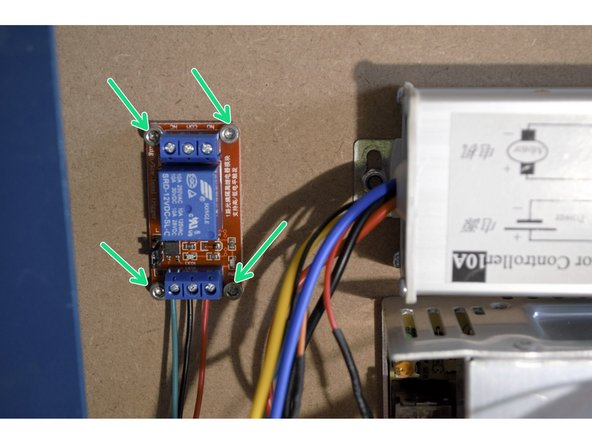 Remove the 4 cap screws mounting the relay