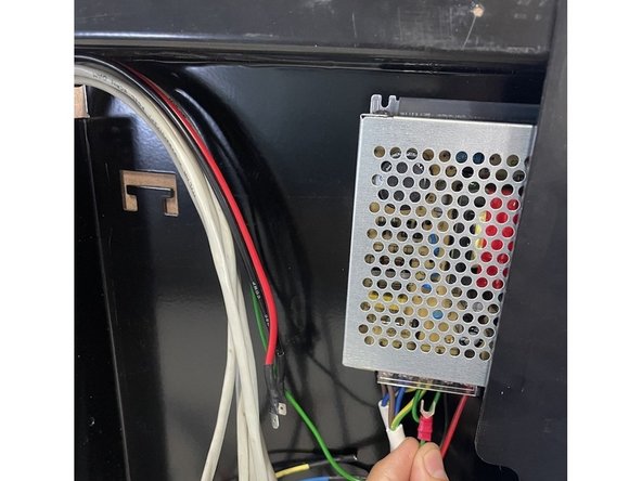 Connect the green ground cable to the earth connection of the 24V power supply. Because the earth connection is bridged to the V- connection, the green earth cable can be connected to the earth connection or the V- connection