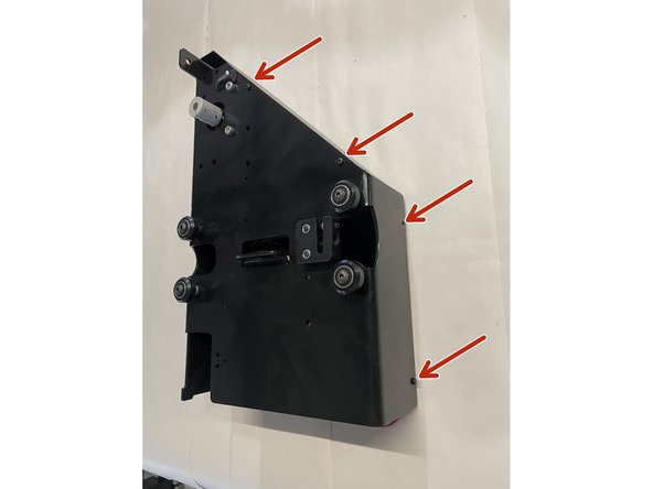 Remove the cover from the right gantry by unscrewing the 6 screws as shown in the pictures with the philips screw driver