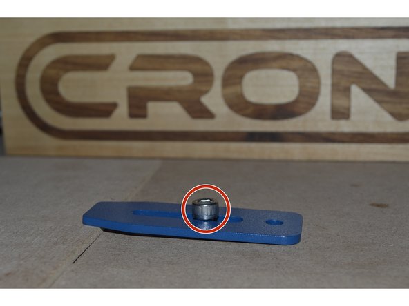 Insert M6x16 Cap screw through adjustable slot on bracket