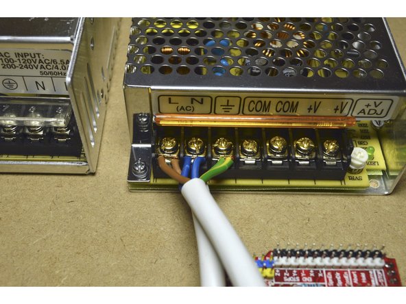 Connect the 220V Power Cable and the 220V Bridge Cable to the 100W Power Supply as shown in the picture