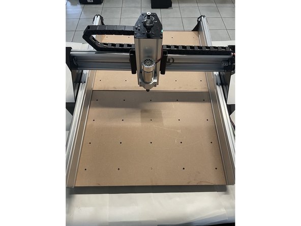 Slide the waste board(s) onto the aluminium profiles as shown in the pictures.  Do not tighten these screws at this stage.