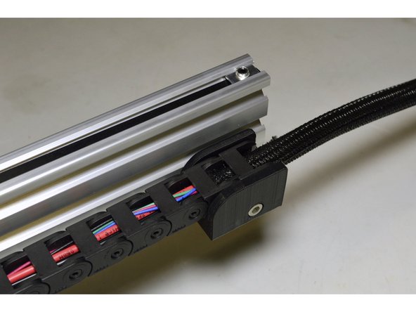 Click the other side of the Drag Chain into the Drag Chain Bracket at the back of the V-Slot profile