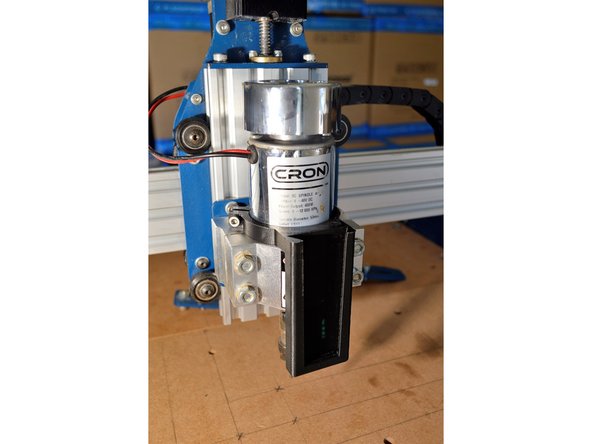 Mount the laser bracket to the spindle as shown