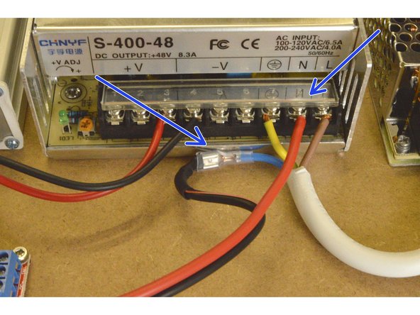 Connect the other end of the Relay COM cable to the 400W power supply by connecting the red cable to the N port and the black cable to the crimp terminal on the blue 220V cable as shown.