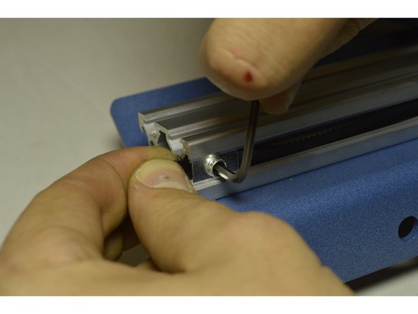 Slide the M5 plate nut over the belt into the V-Slot