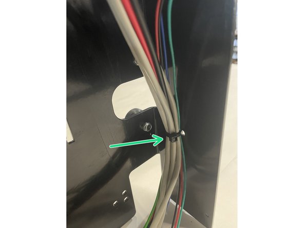 Cut the tail of the cable tie off with a side cutter.