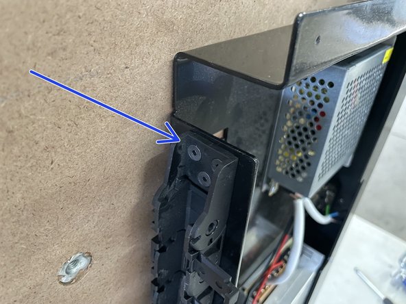 The drag chain can only be fastened in one orientation due to the spacing of the holes.  So if the 3 holes in the drag chain does not line up with the holes in the steel plate, flip the drag chain around.