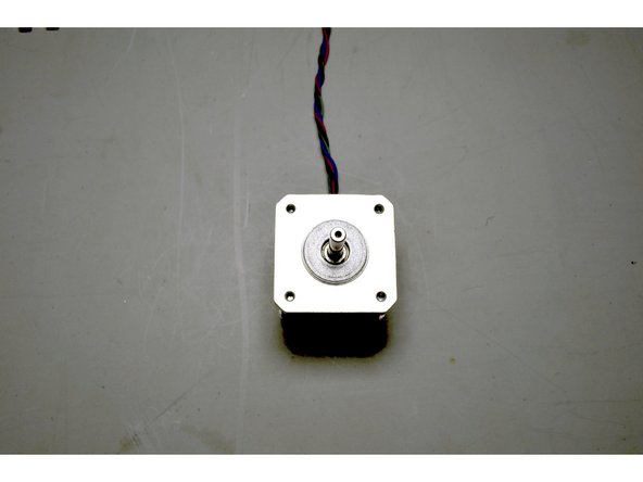 Place the X-Motor on the table with the wires facing away to the top