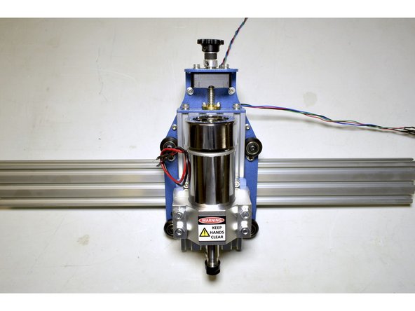 Slide the 20x60 V-Slot profile into the X-Axis Assembly as shown