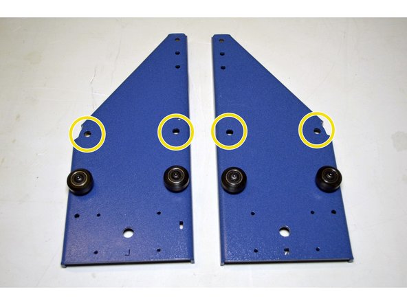 Mount 4 V-wheels to the holes circled in YELLOW with the eccentric nuts instead of the aluminium spacers.