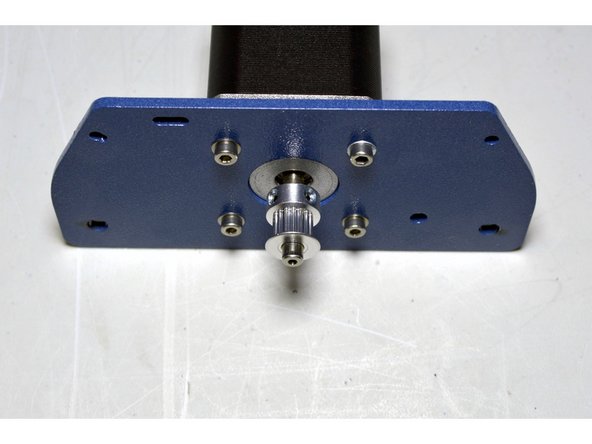 Slide the GT2 pulley onto the motor shaft with the bigger flanch facing the motor