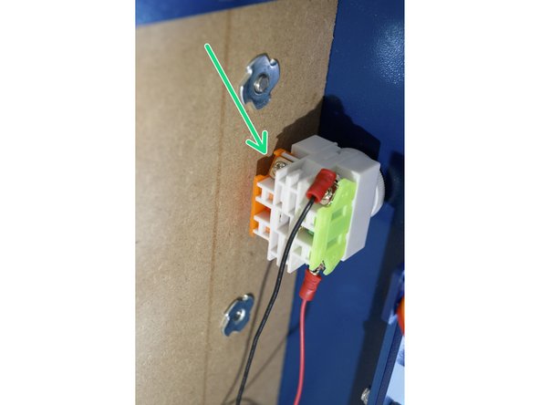 Connect the short red cable (centre pin on toggle switch) to the orange side (normally closed) on the E-Stop