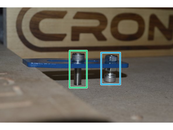 Insert M6x30 Cap screw through adjustable slot on bracket