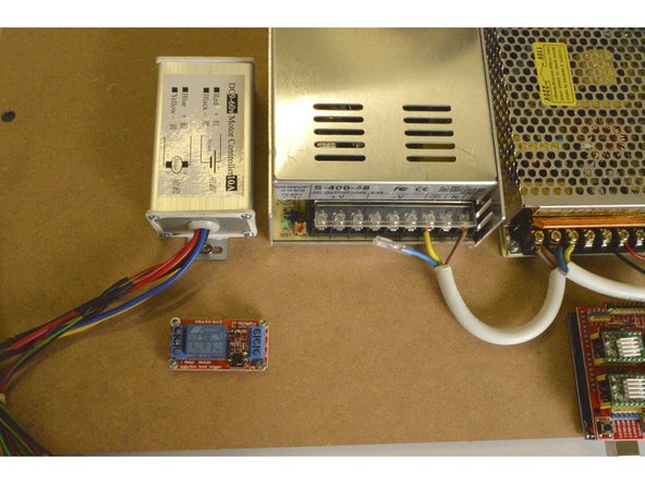 Mount the Spindle Speed Controller as shown with the M4x8 Cap Screws (2 Pcs) and the M4 Lock Nuts (2 Pcs)
