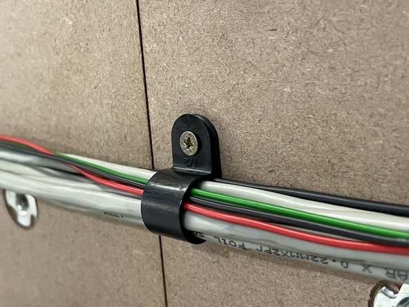 The wiring for the Medium machines will be longer than needed and you will only need 2 x P-Clamps.  So the other 2 x P-Clamps can be used to make a circle with the wiring and fasten it to the waste board.